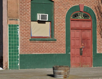 Front entrance of 125 Cherry Ave LB, LLC with welcoming signage and greenery.