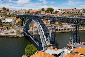 gray metal bridge over river during daytime