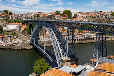 gray metal bridge over river during daytime