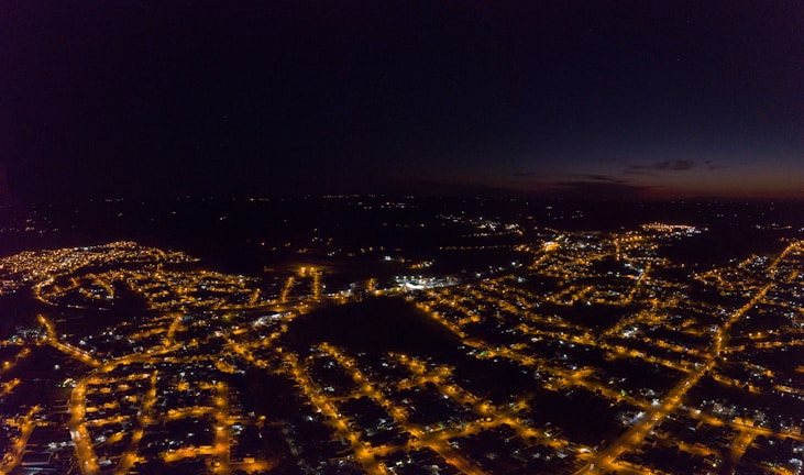 Thermal camera view showing heat signatures in an urban environment at night