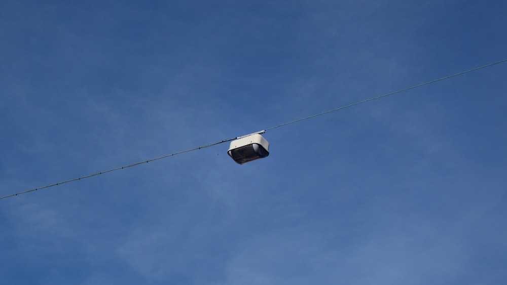 white and black cable car under blue sky during daytime