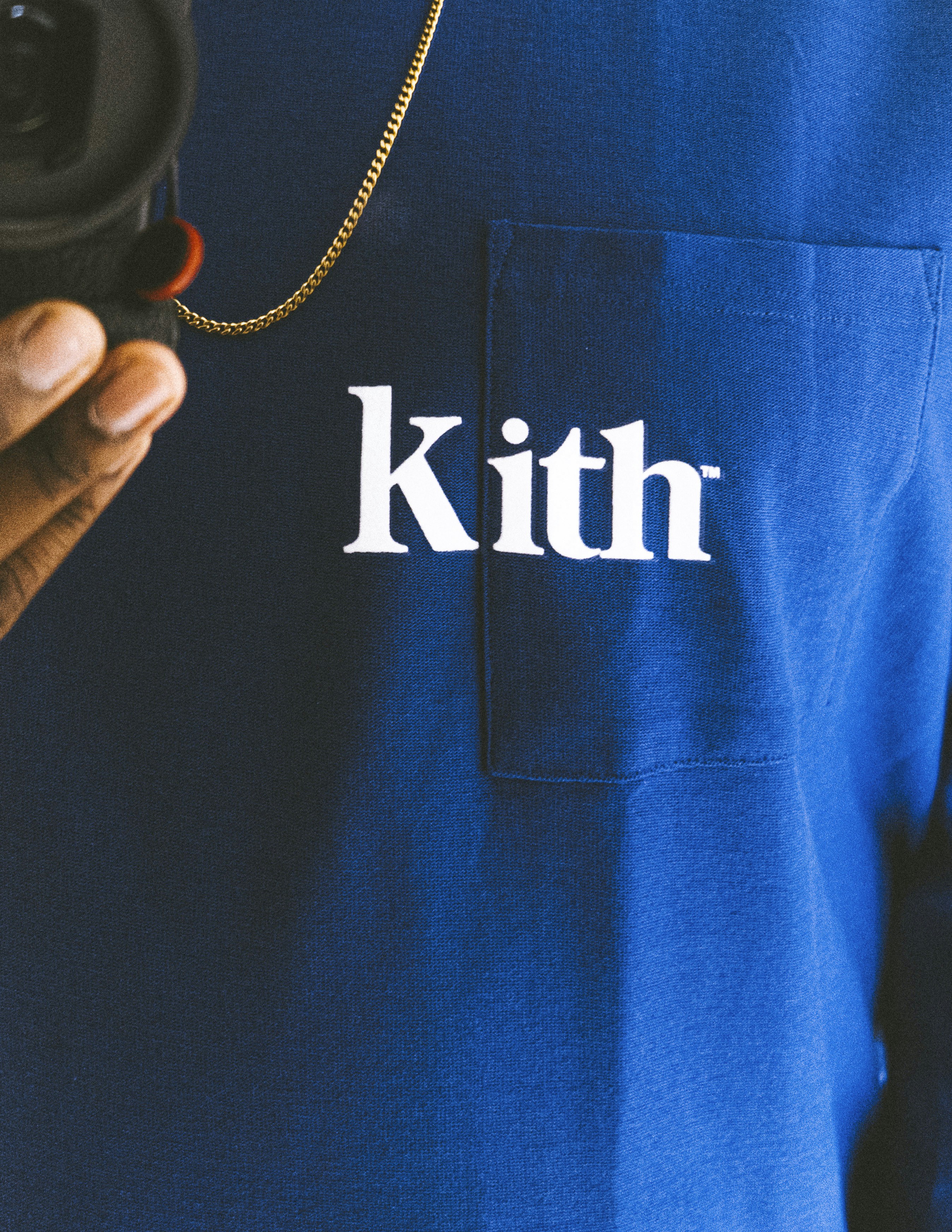 person holding black and white camera