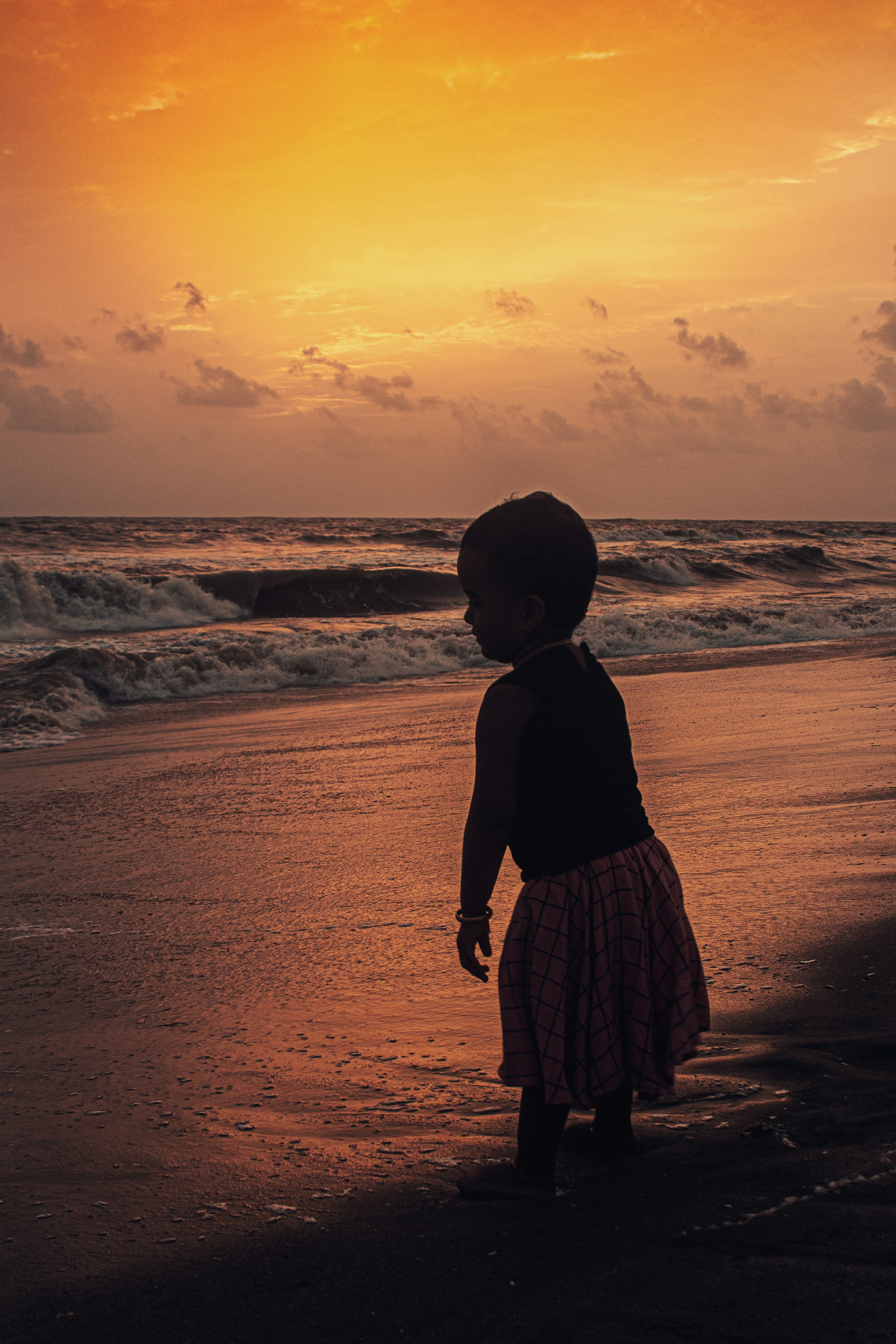 Kid enjoying beach at Kozhikode in Kerala