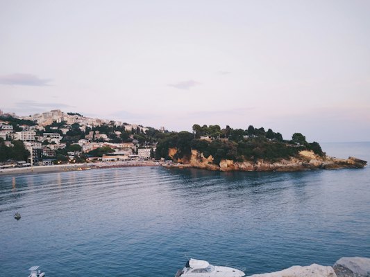 Body of water near mountain during daytime — Ulcinj, Montenegro