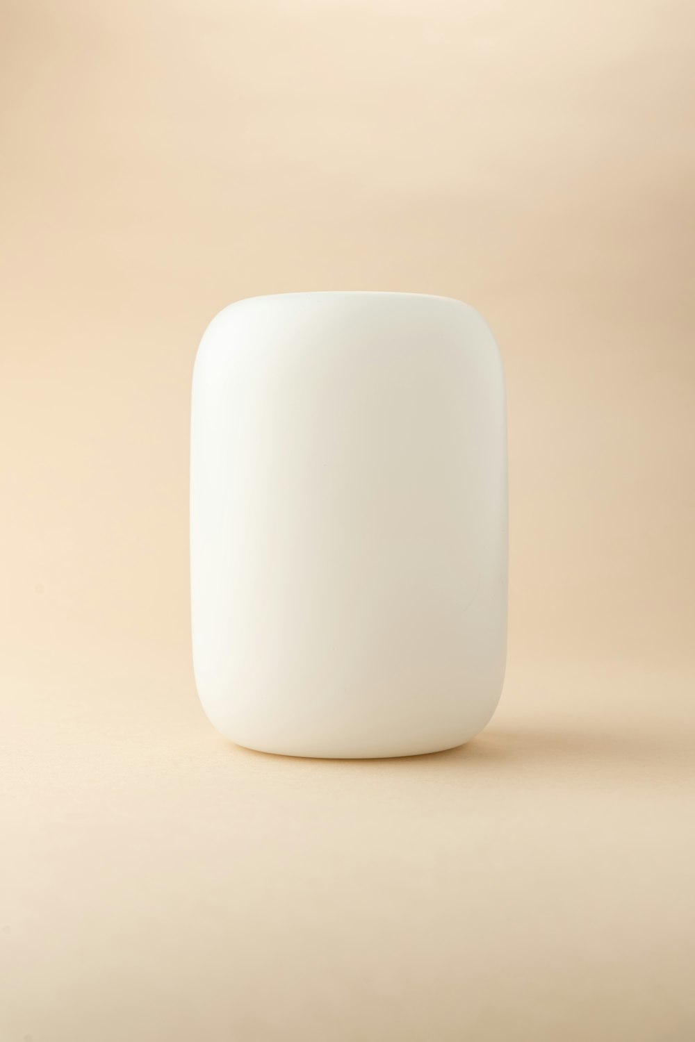 white plastic container on white table