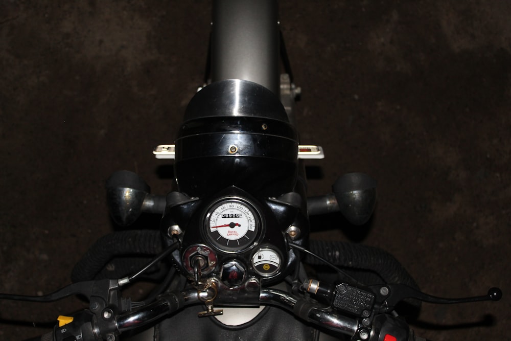 black motorcycle engine on brown floor