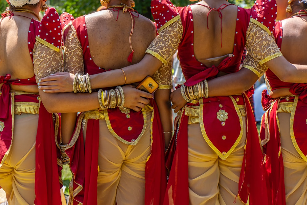 woman in gold and red sari dress