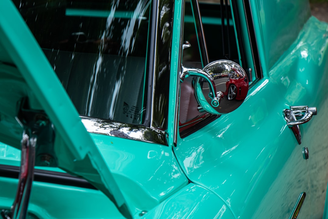 red car with silver door lever