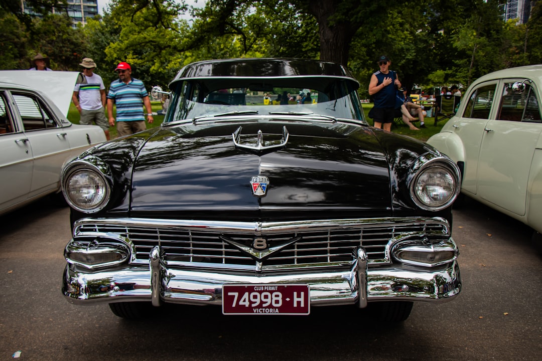 black classic car on road during daytime