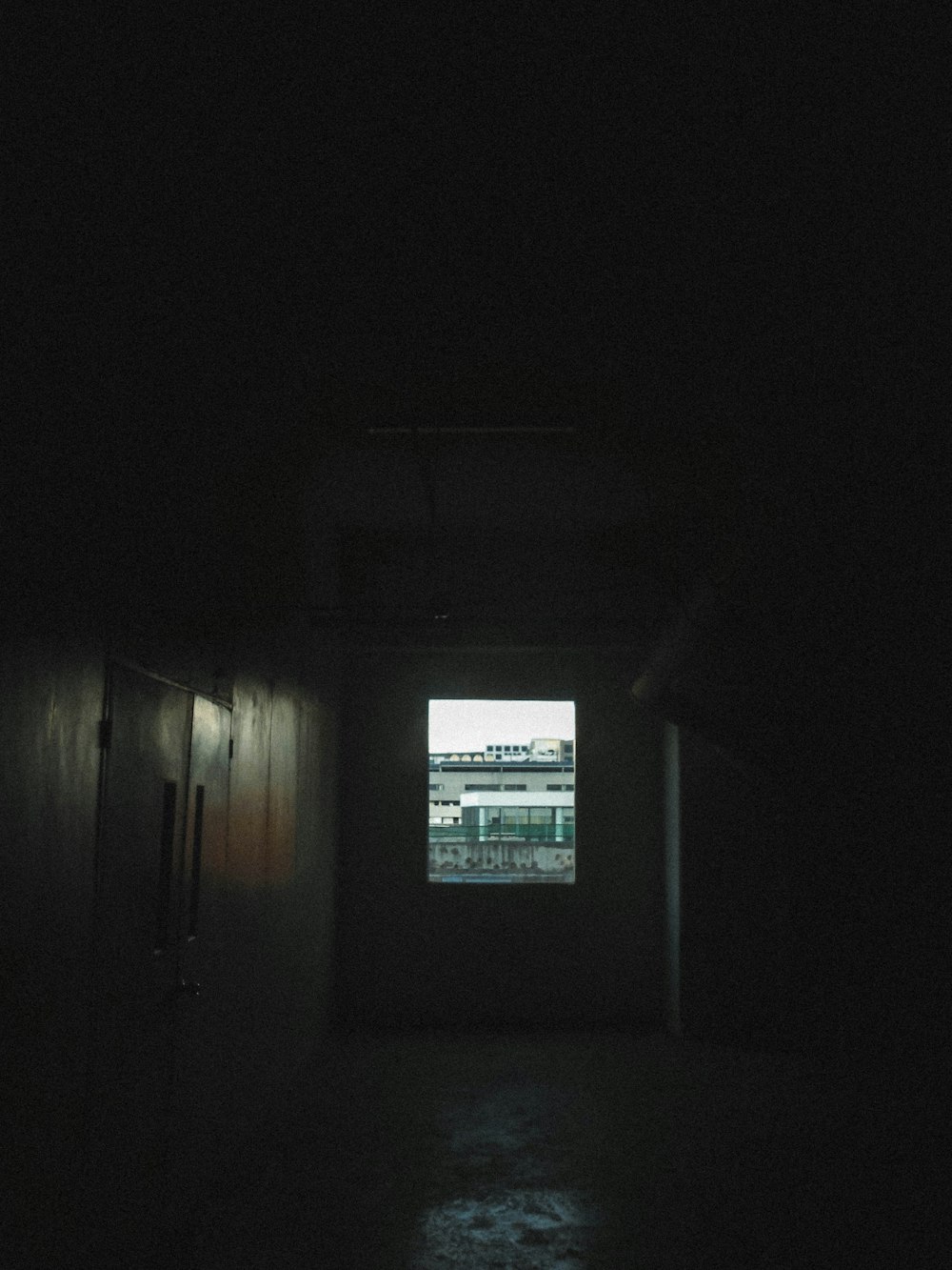 a dark room with a window in it