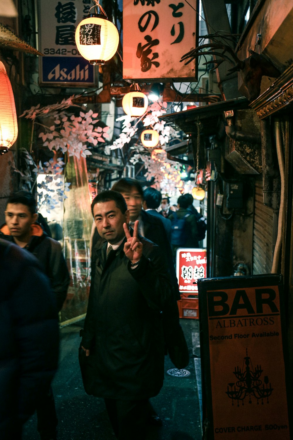 man in black jacket standing beside woman in black jacket