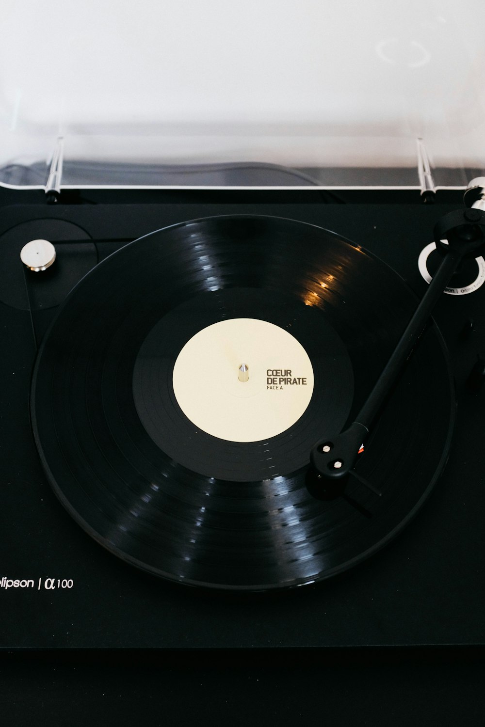 black vinyl record player on white table