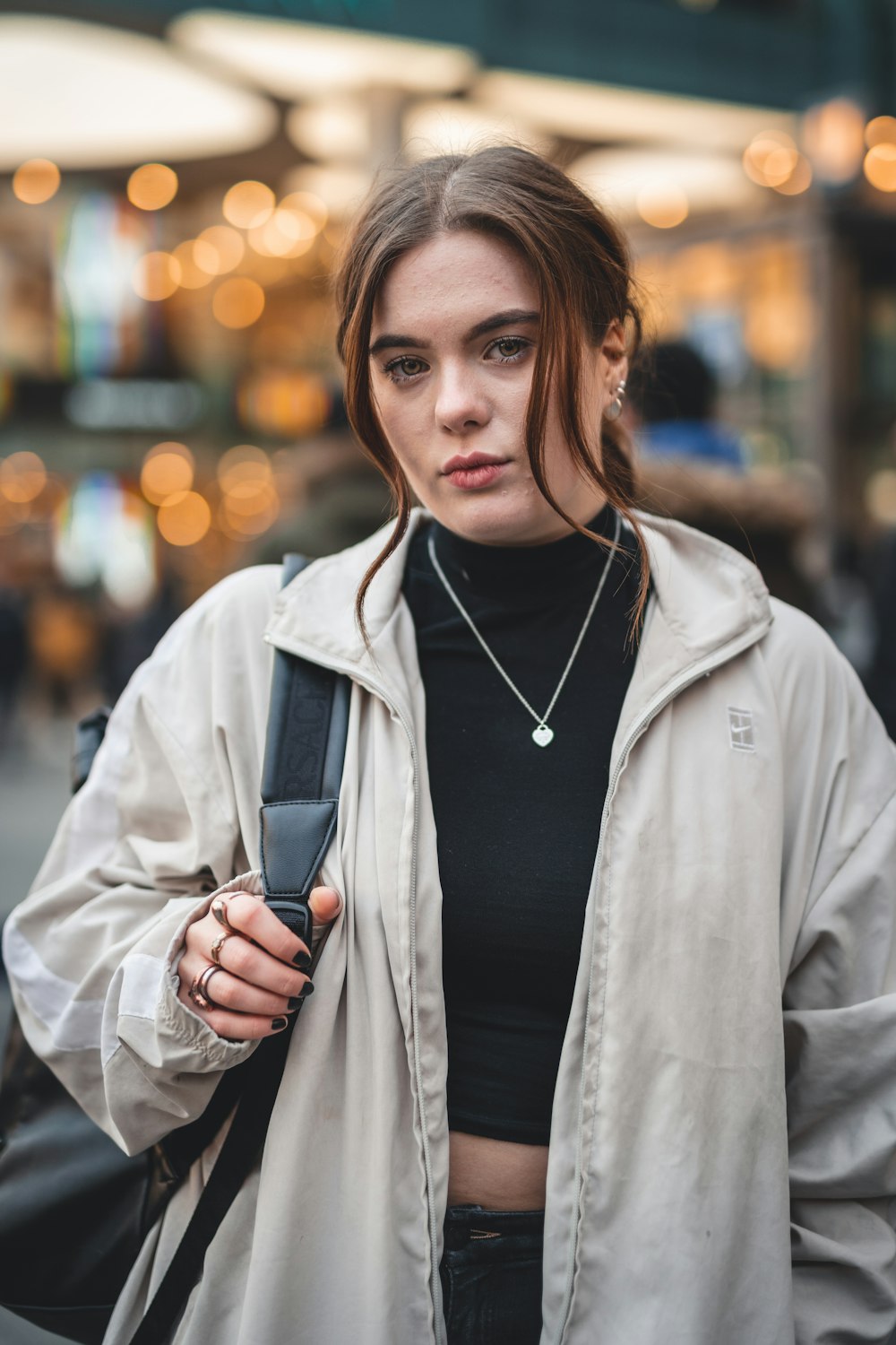 woman in gray coat smiling