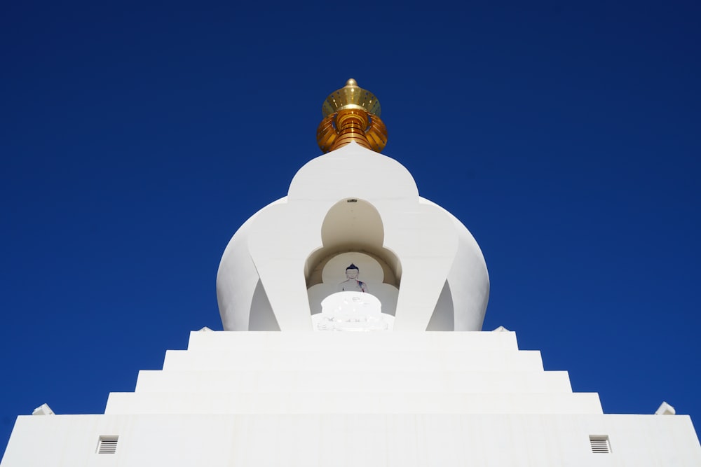 white concrete building under blue sky during daytime