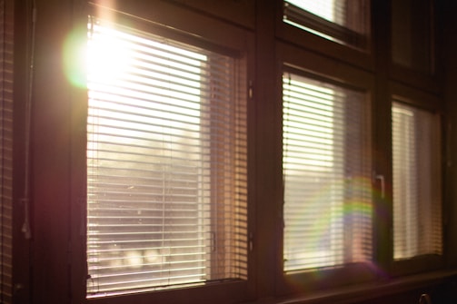 white window blinds on window