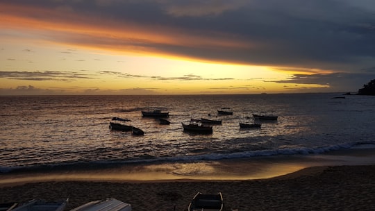 silhouette of boats on sea during sunset in Rio Vermelho Brasil