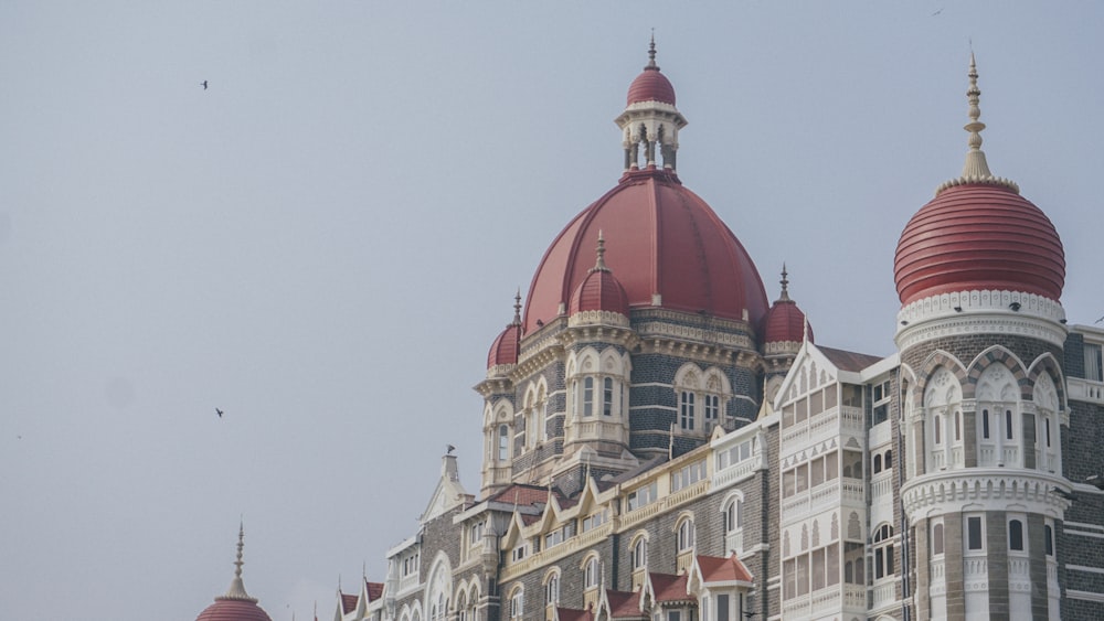 a large building with a red dome on top of it