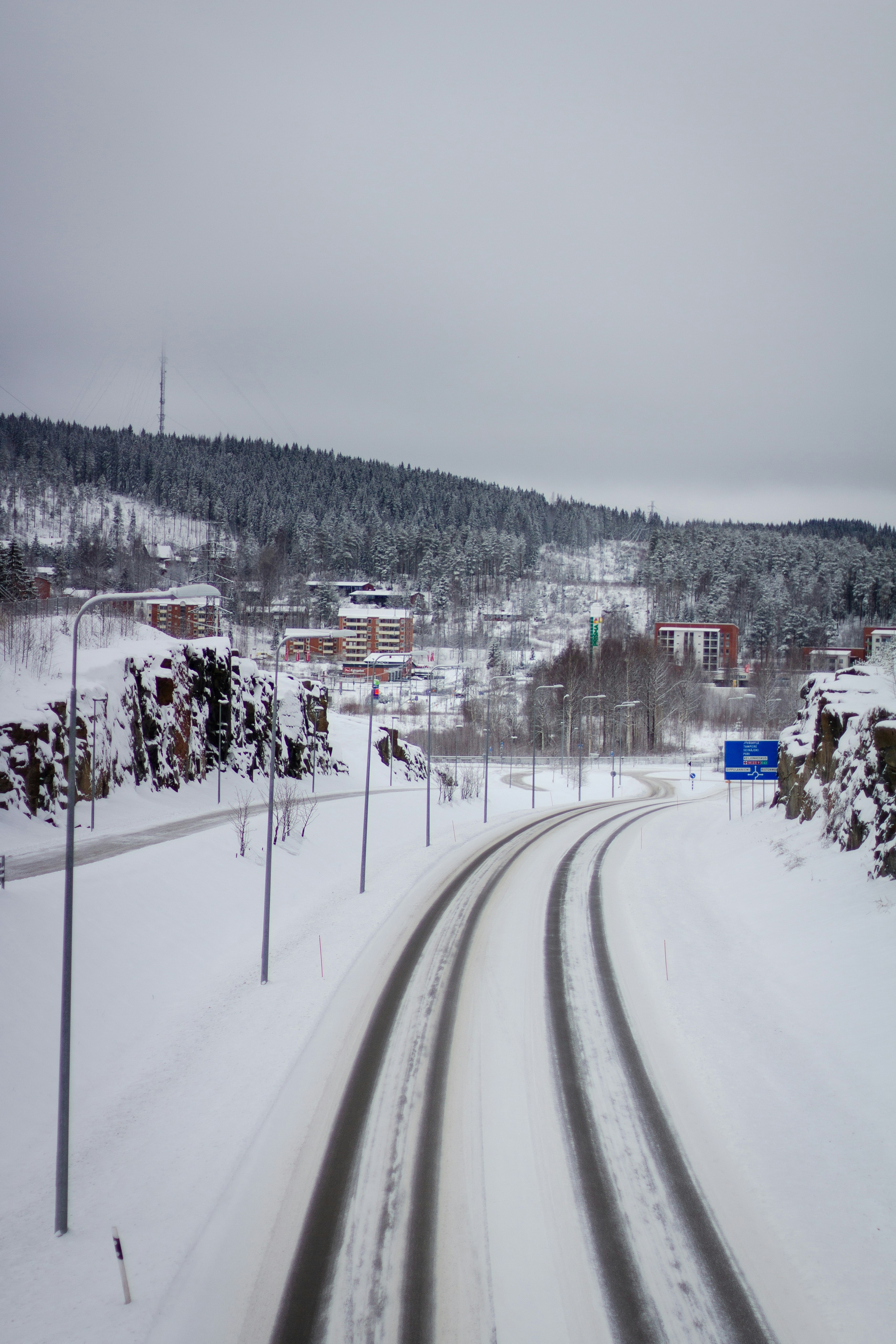 snow covered road during daytime