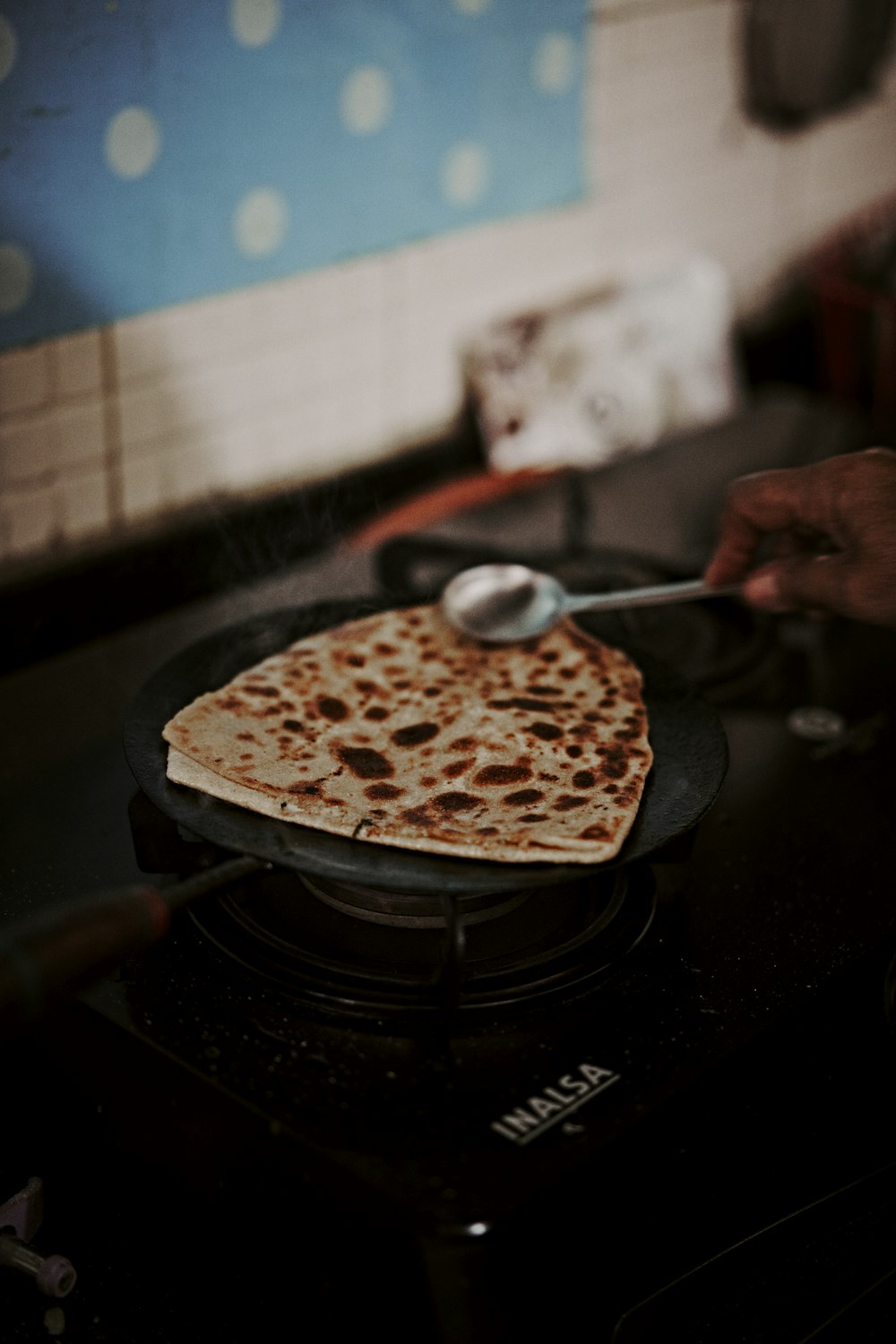 person holding spoon with food on top