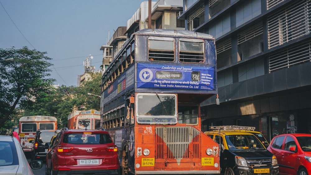 red and yellow bus on road during daytime