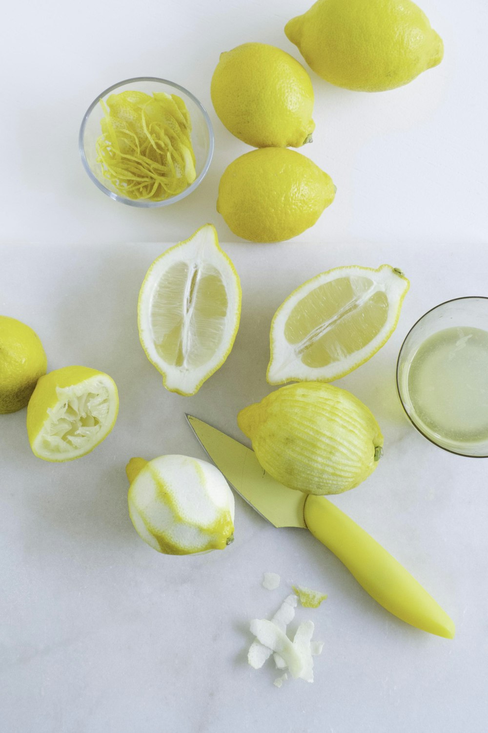 sliced lemon fruit on white surface