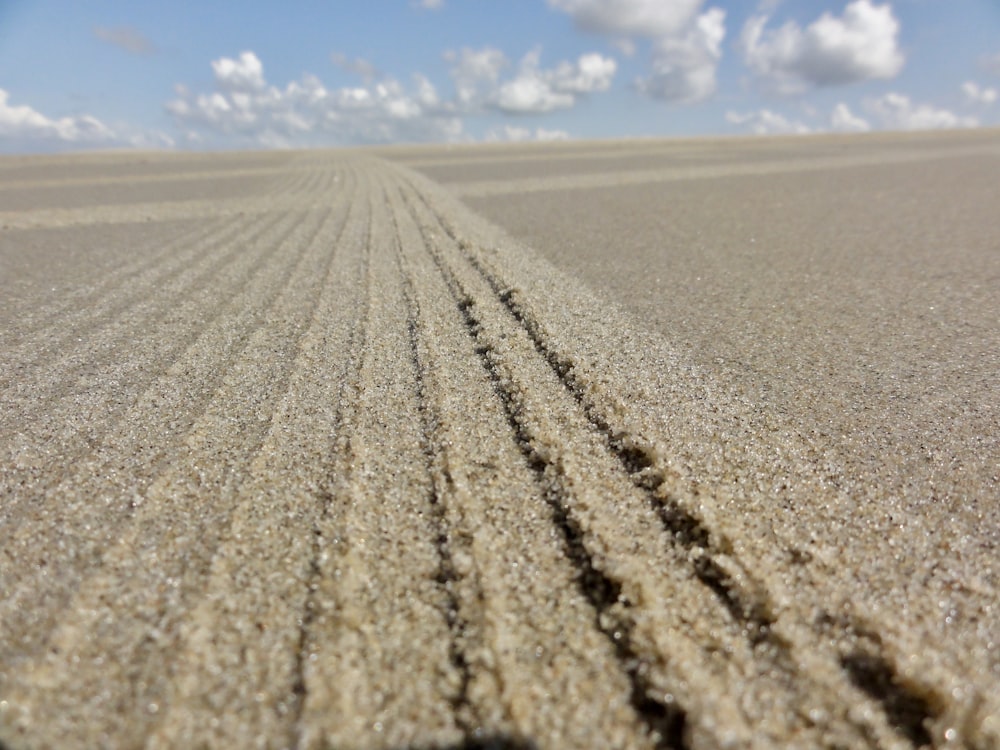 brown sand under blue sky during daytime