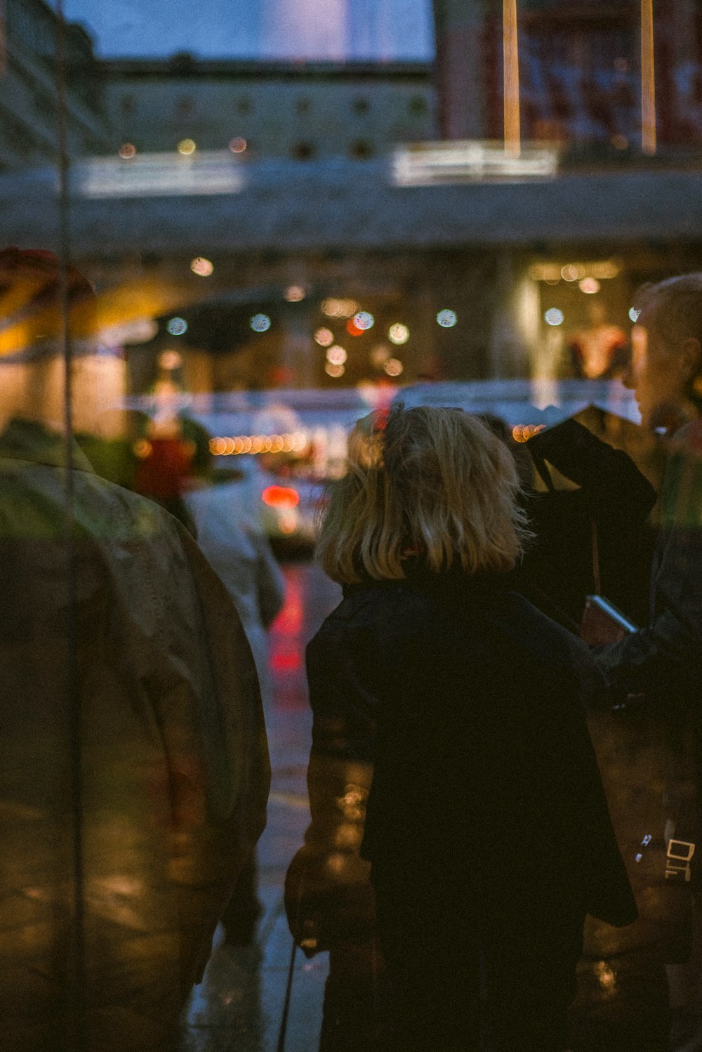 people walking on street during night time