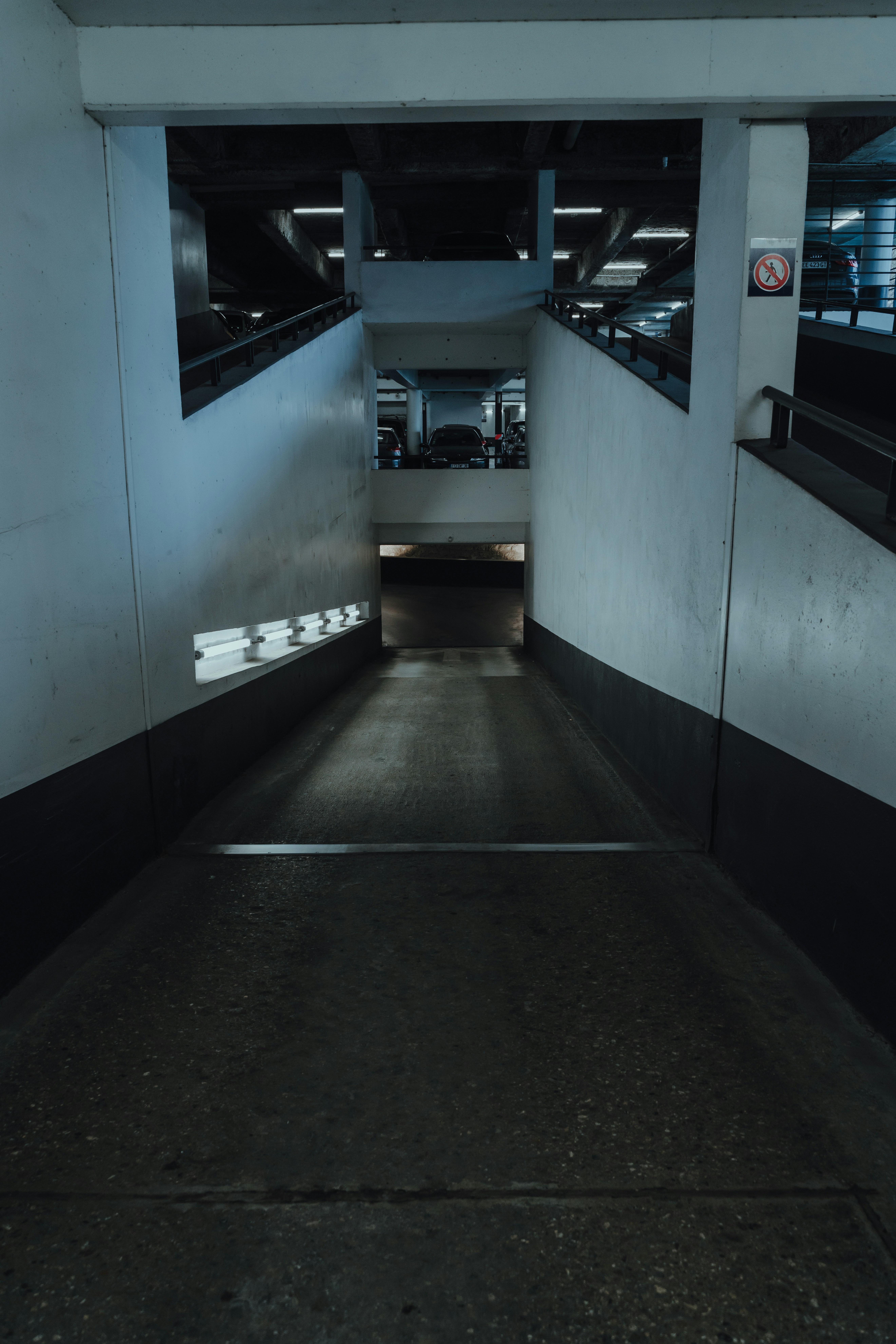 black and white hallway with white wall
