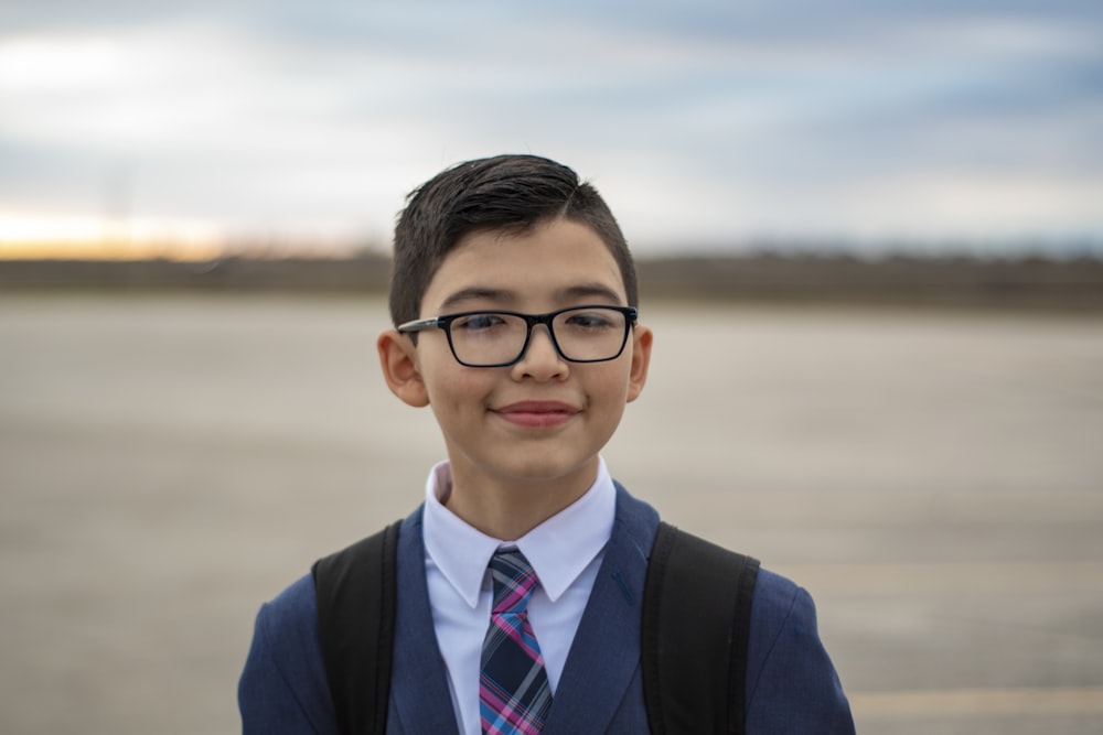 man in black suit wearing eyeglasses