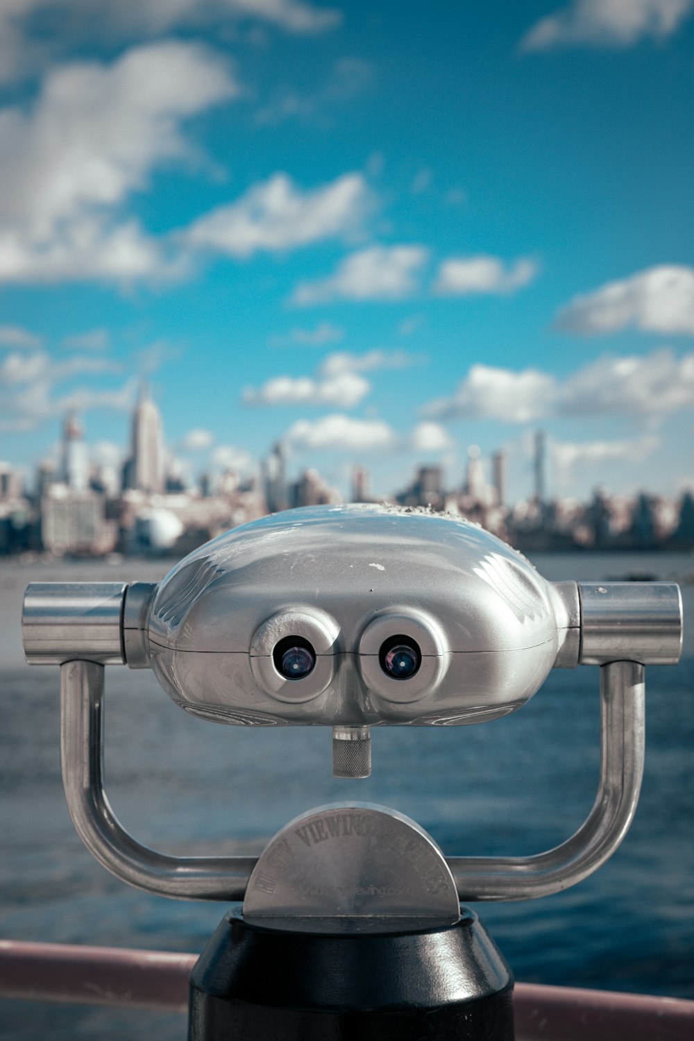 gray and black coin operated binoculars