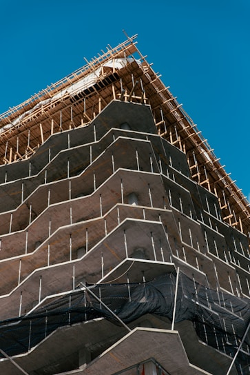 brown concrete building under blue sky during daytime