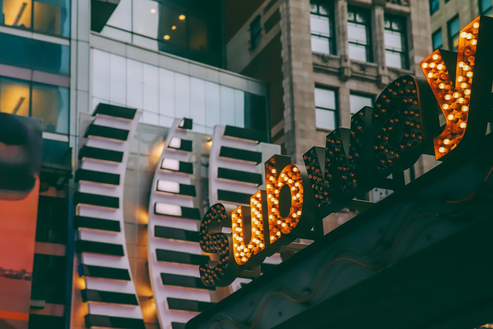 a close up of a street sign with a building in the background