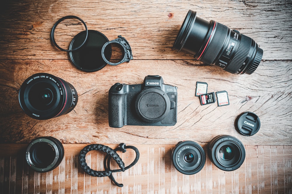 black nikon dslr camera on brown wooden table