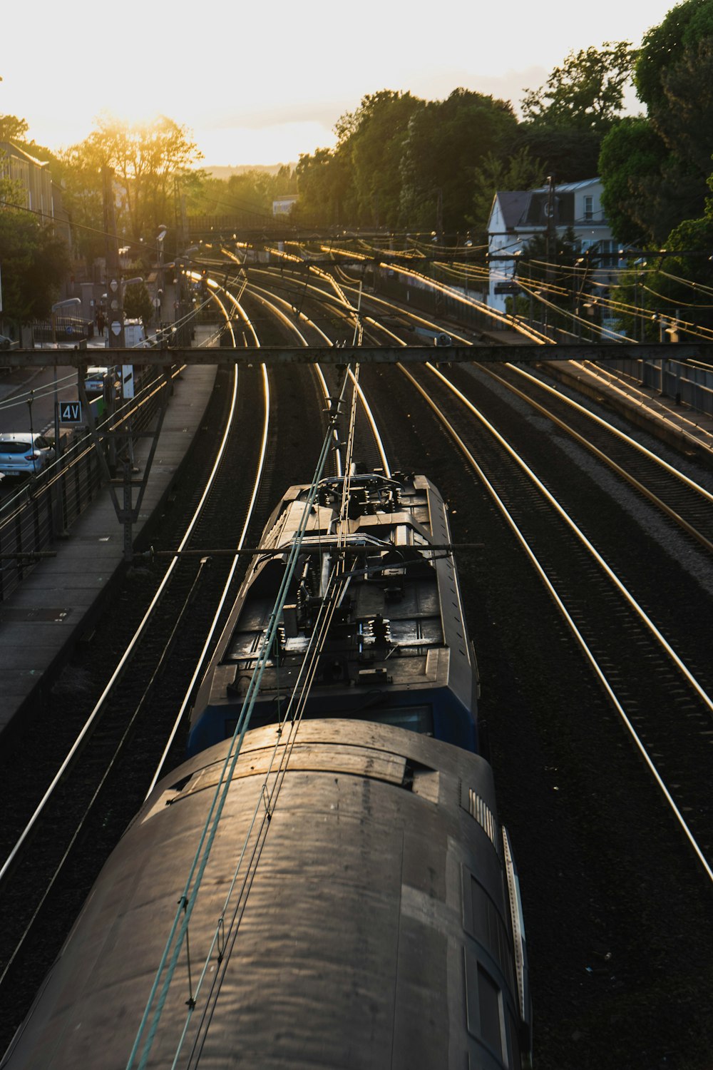 white and black train on rail road during daytime