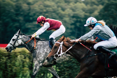 Close-up of a jockey focused during a fast-paced horse race.