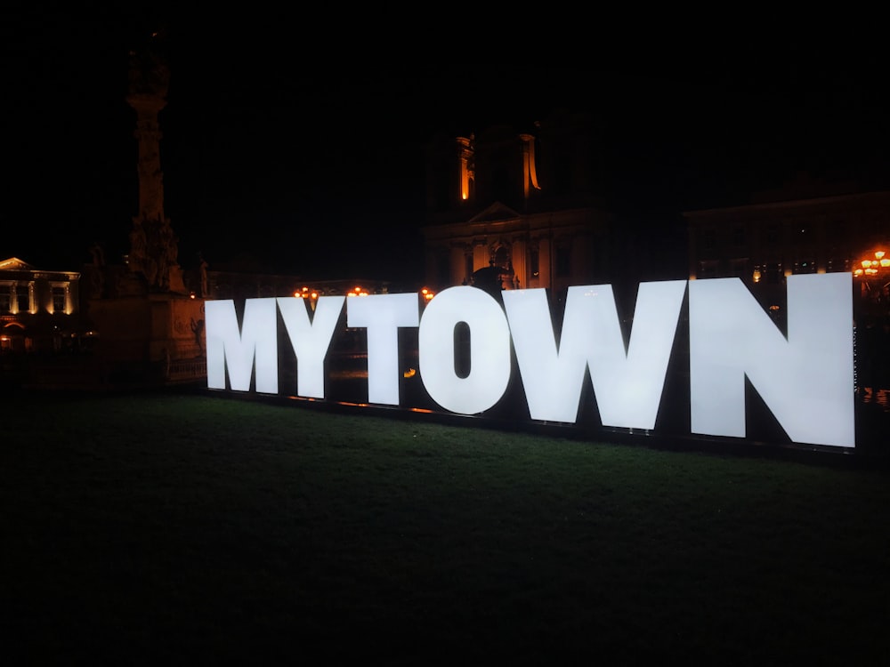 white love freestanding letters on green grass field during night time