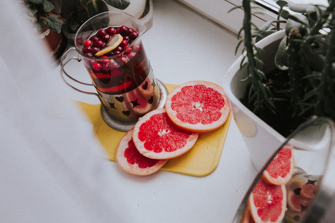 sliced orange fruit on white plate