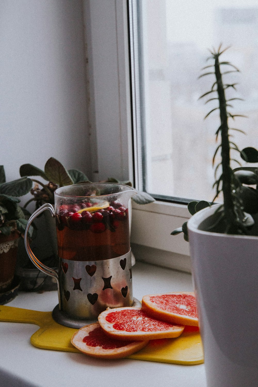 white ceramic mug with strawberry and banana print