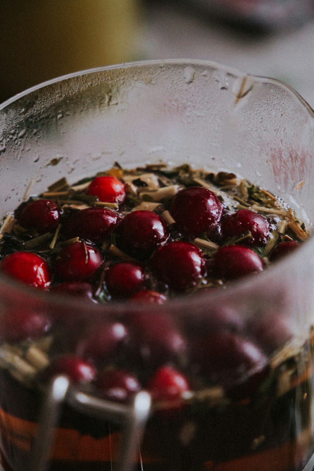 red round fruits in clear glass bowl