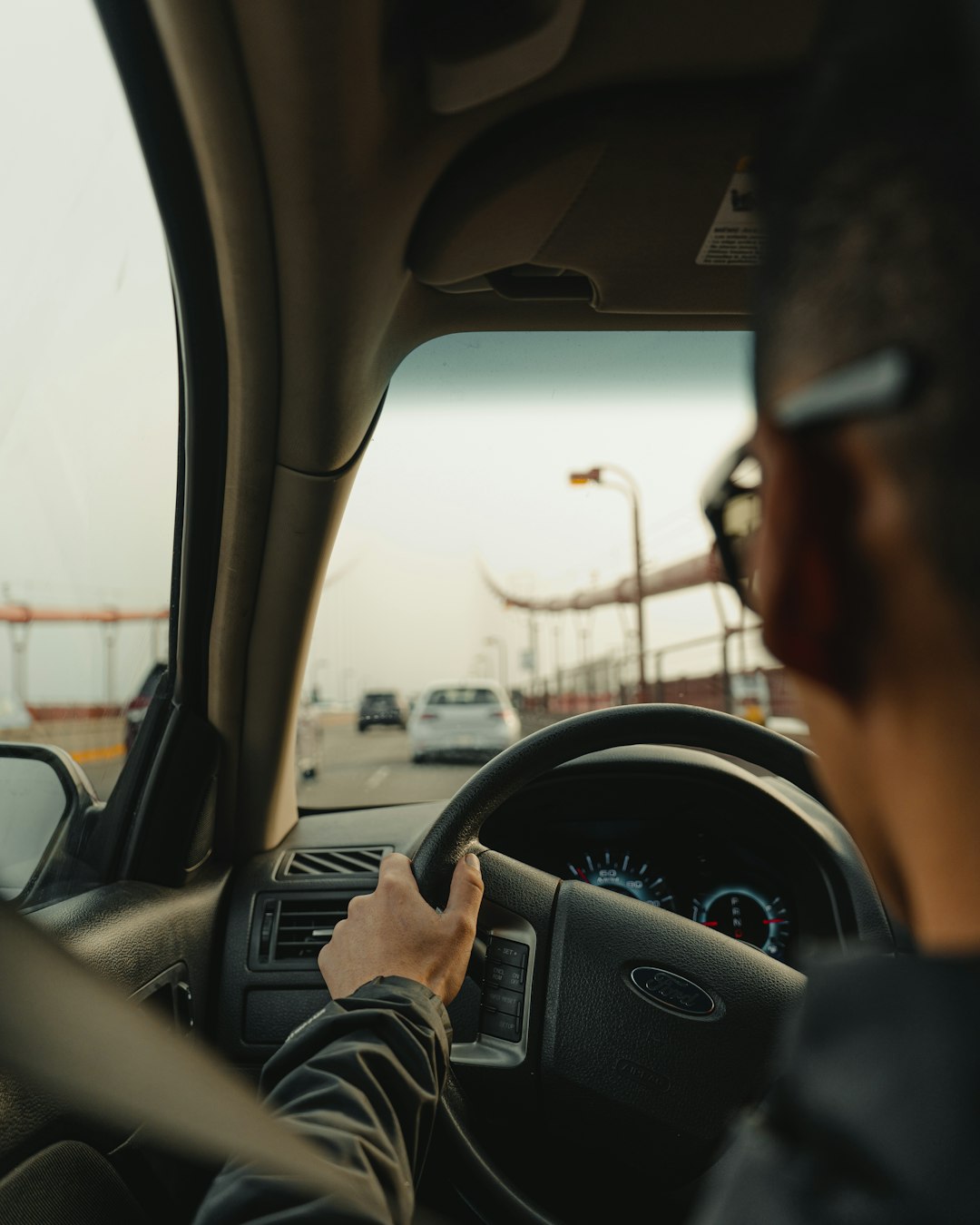 person driving car during daytime