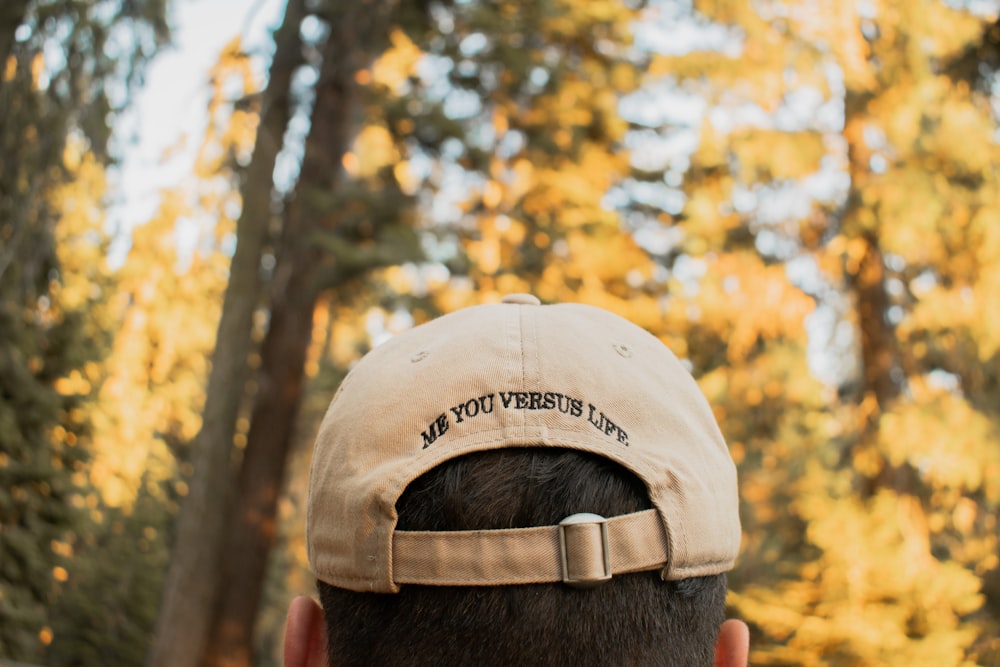 man in brown and black cap