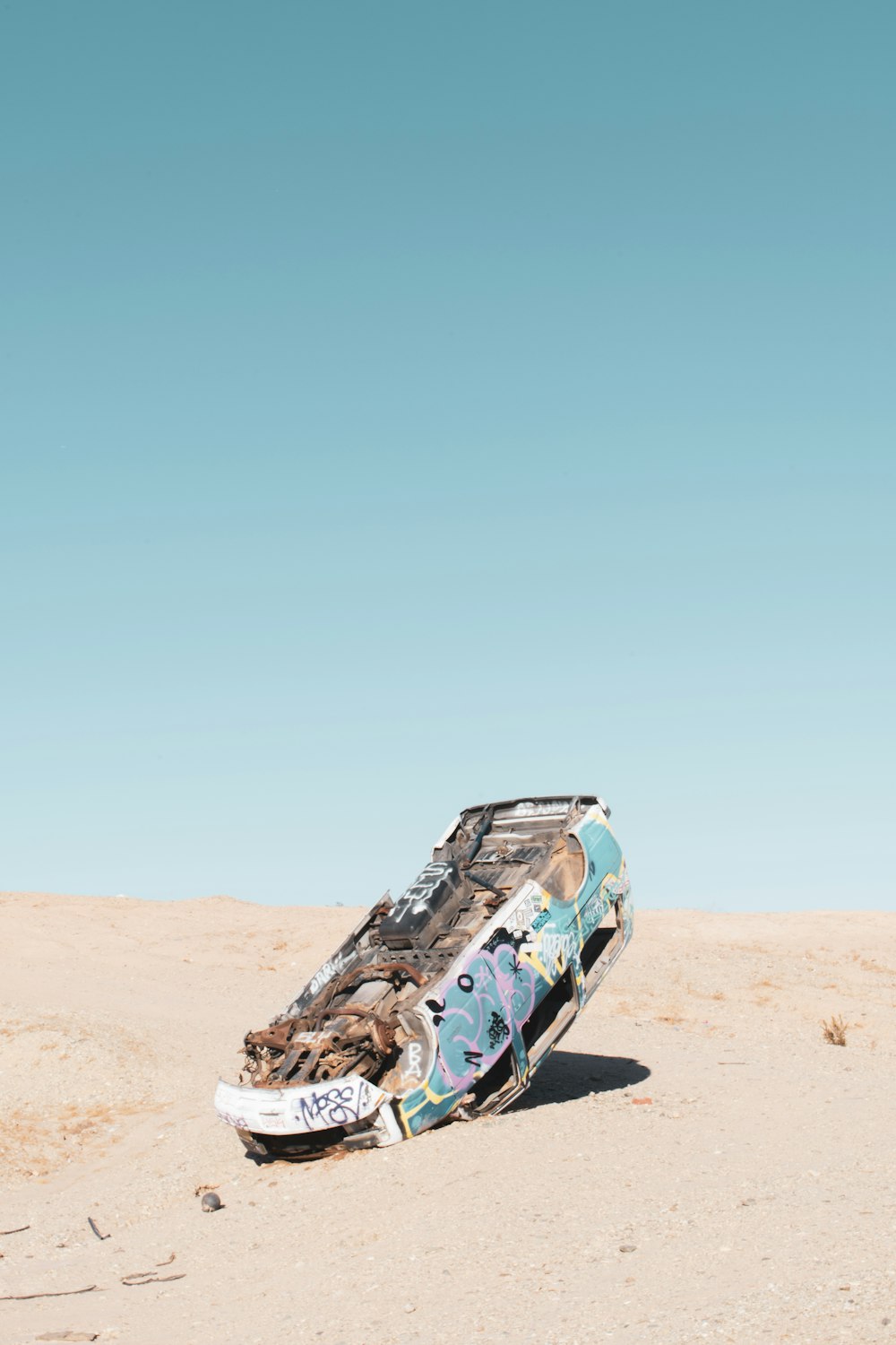 a boat that is sitting in the sand