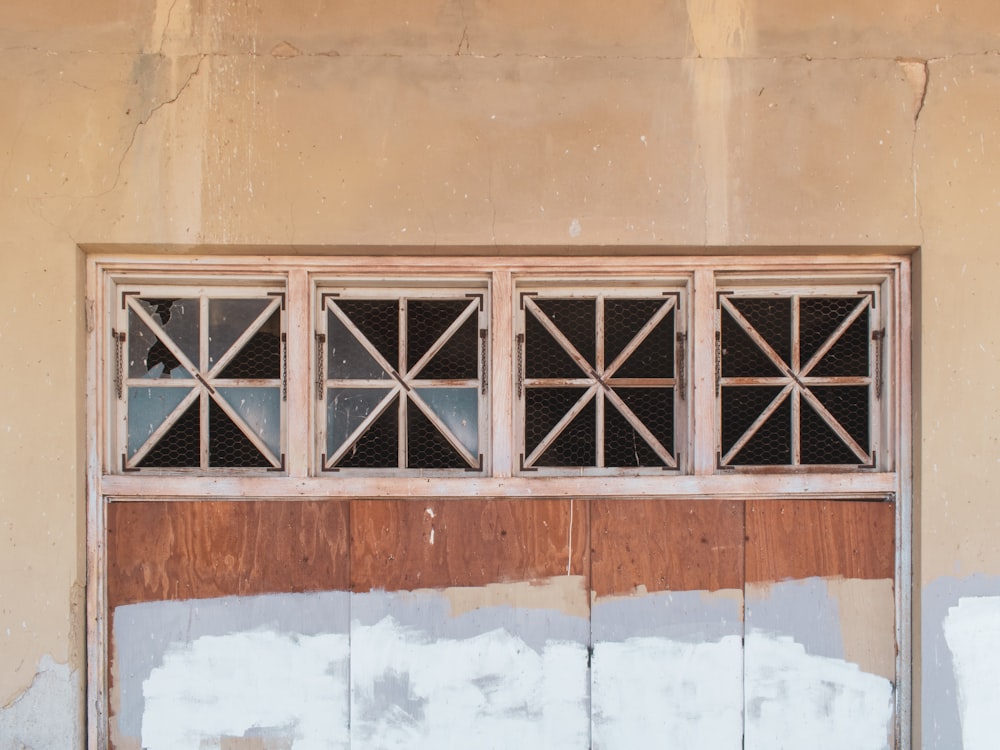 a wooden door with a window on the side of a building