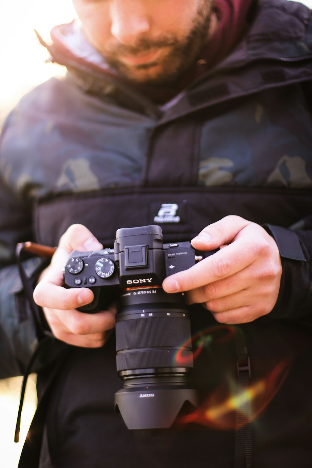 person holding black nikon dslr camera