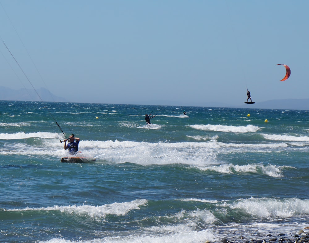 man surfing on sea waves during daytime