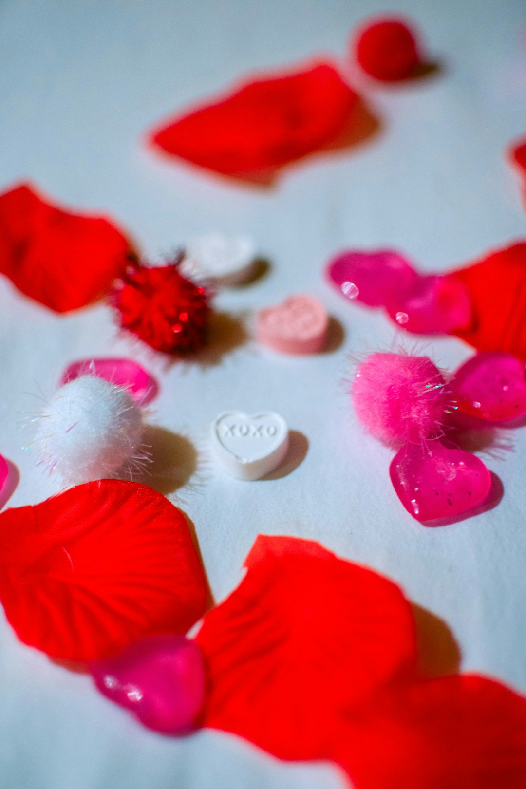 red petals on white textile