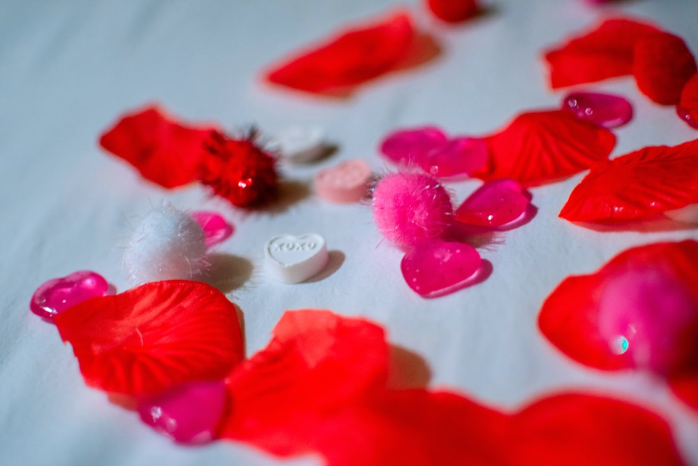 red petals on white textile