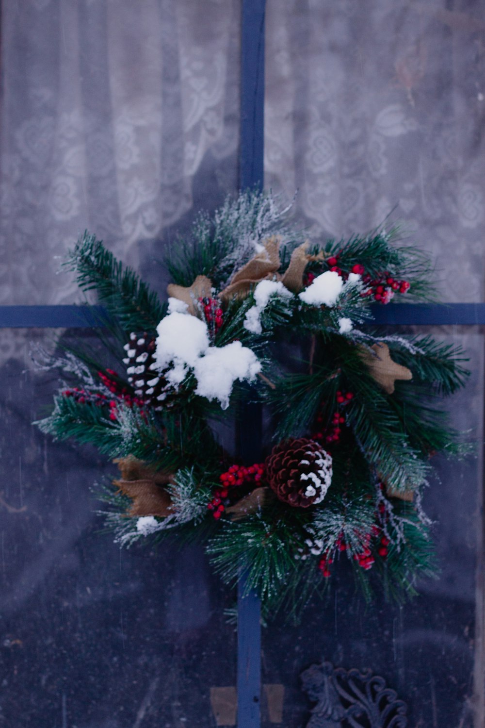 green christmas tree with white and red baubles