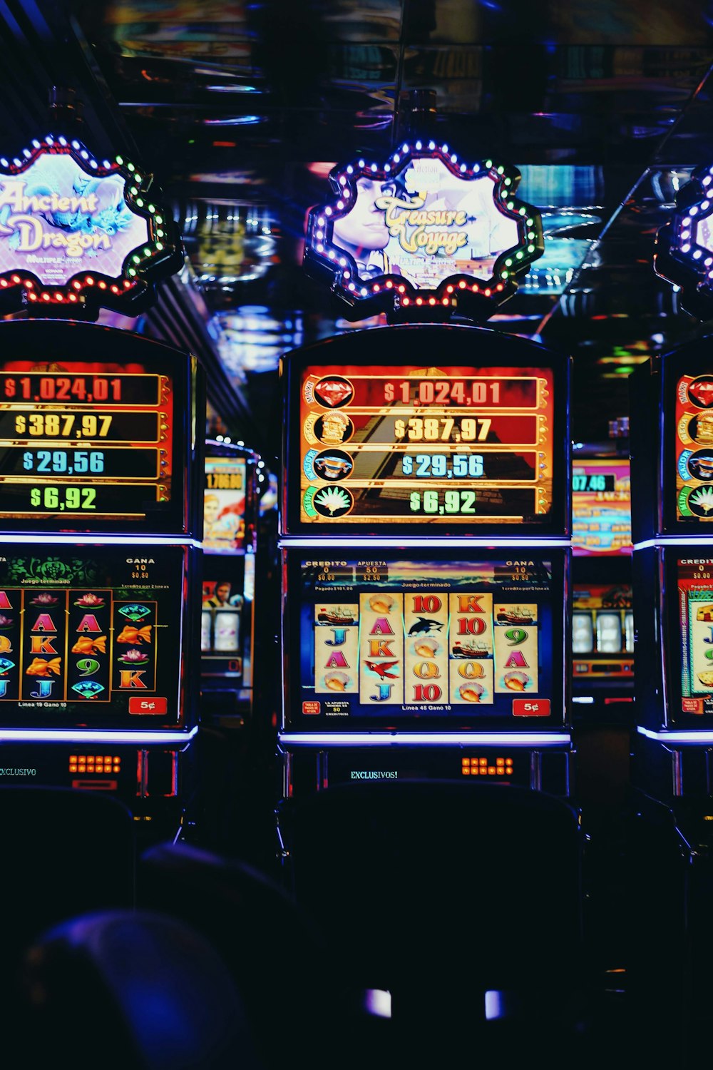 a row of slot machines sitting next to each other