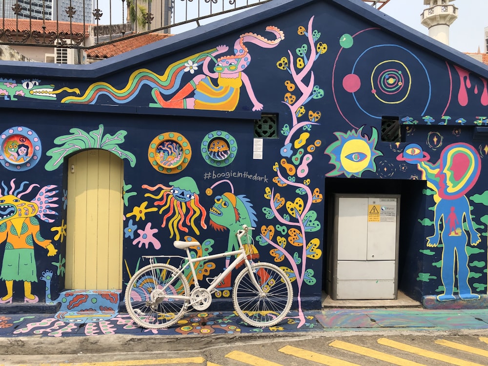 a bike is parked in front of a building